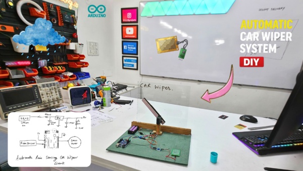 Automatic rain sensing car wiper prototype using Arduino Uno, rain sensor module, servo motor and lithium battery setup on testing table